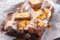 Snickers Overload Poke Cake