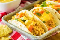 Creamy Slow Cooker Queso Chicken Tacos