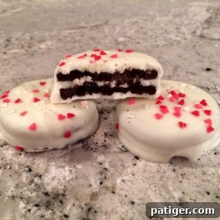 Love-Dipped White Chocolate Oreos 5 White Chocolate Covered Valentine's Day Oreos with heart sprinkles.