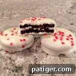 Love-Dipped White Chocolate Oreos 6 White Chocolate Covered Valentine's Day Oreos with heart sprinkles.