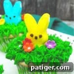 Miniature Peeps Easter cupcake with green frosting and marshmallow bunny.