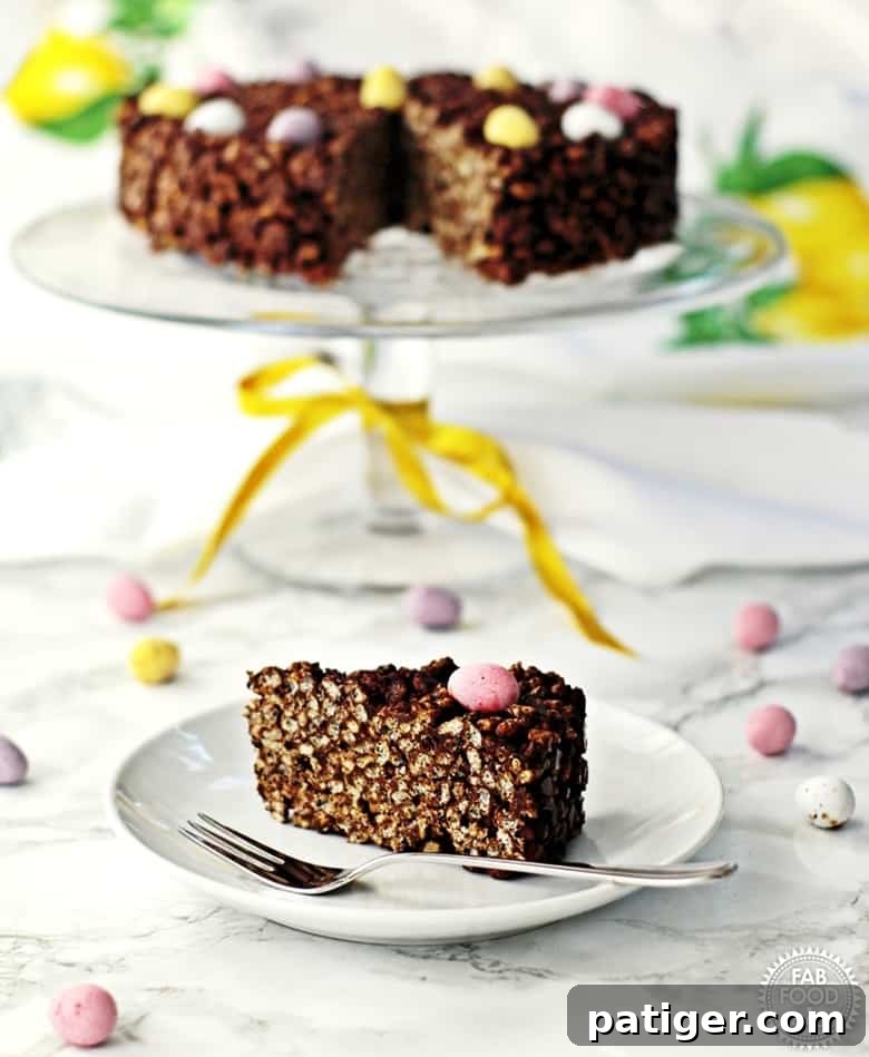 Chocolate Rice Crispy Cake topped with pastel mini candy eggs.