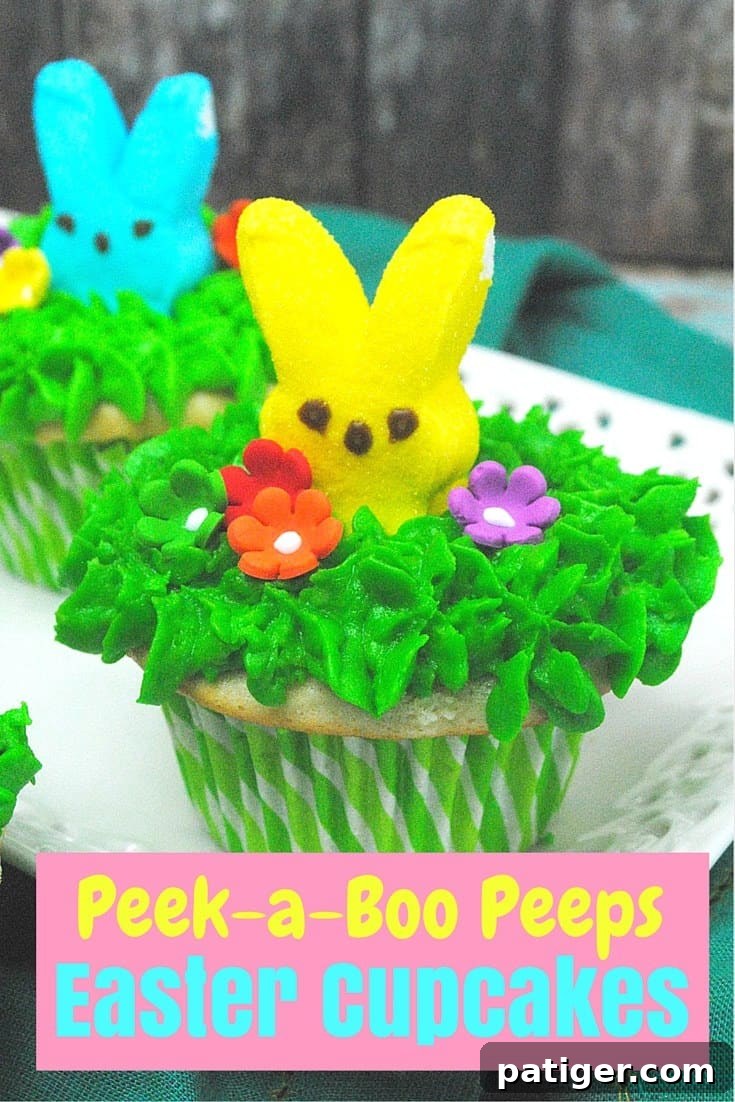 Vanilla cupcake with green frosting and yellow peeps and colorful candy flowers sticking out of the top.