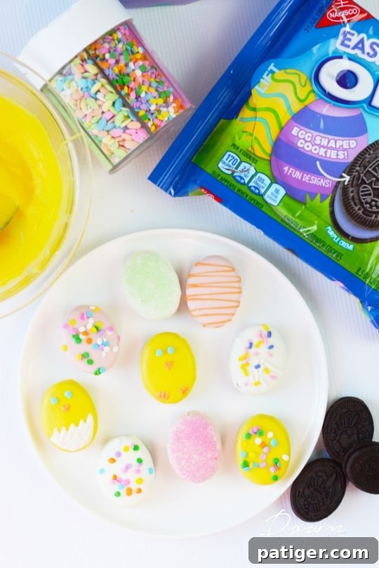 Easter Egg shaped OREO Cookies coated in colored melted chocolate and decorated to look like colorful easter eggs and easter chicks.