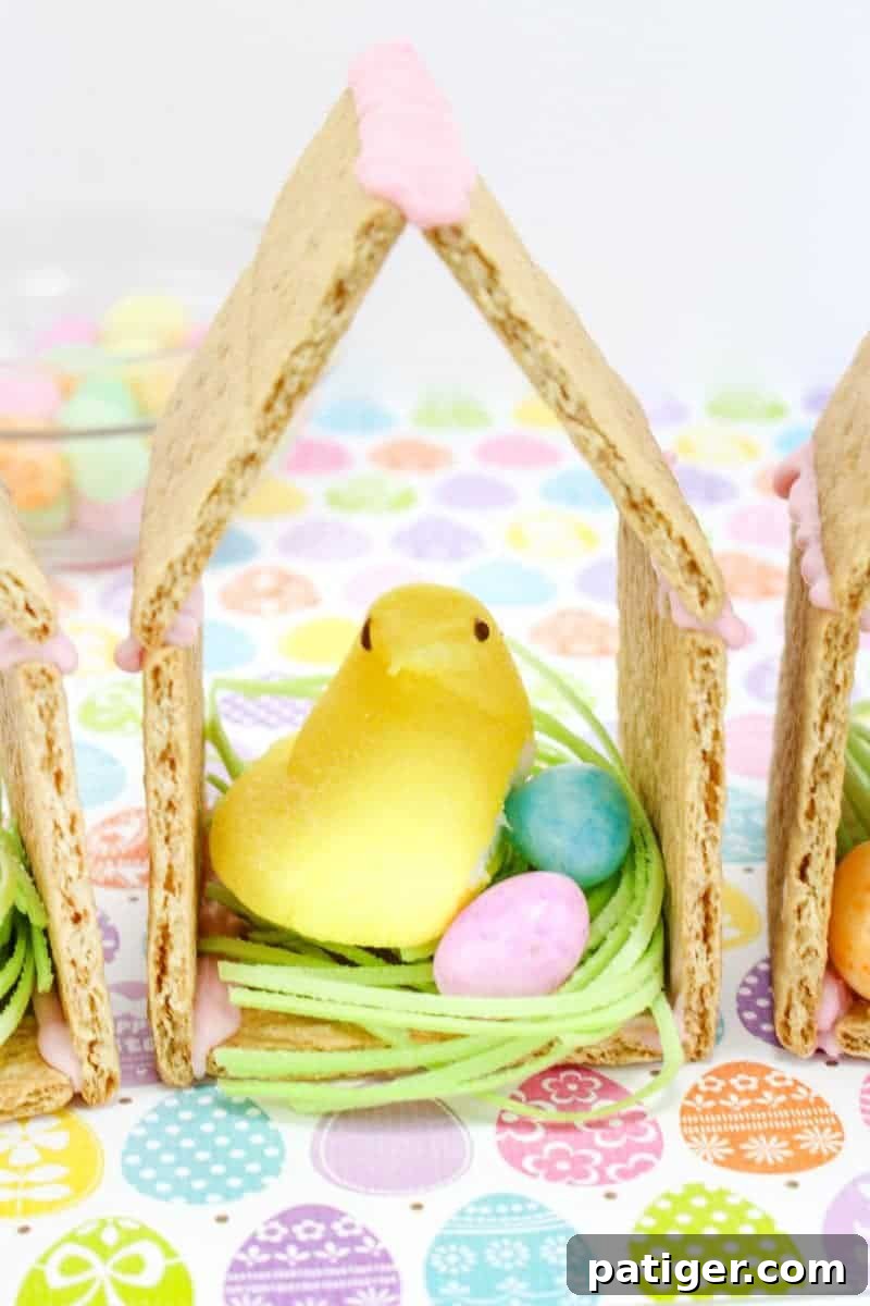 Peeps chicks houses made using Peeps Chicks, graham crackers, egg candies, and edible grass.