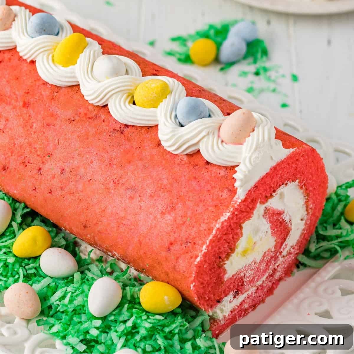Easter cake roll with whipped cream filling and mini eggs.