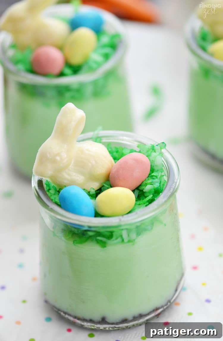 Pistachio Pudding Parfaits topped with chocolate bunnies and candy eggs.