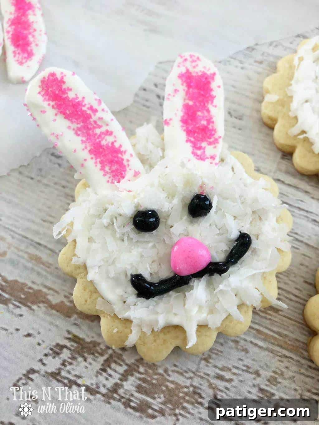 Sugar cookies decorated to look like bunny faces.