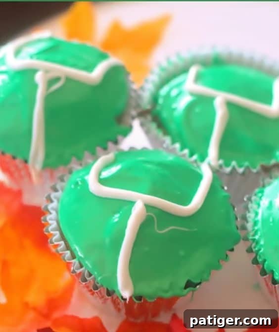 Easy game day cupcakes decorated with vibrant green icing and white goalposts, perfect for football season celebrations.