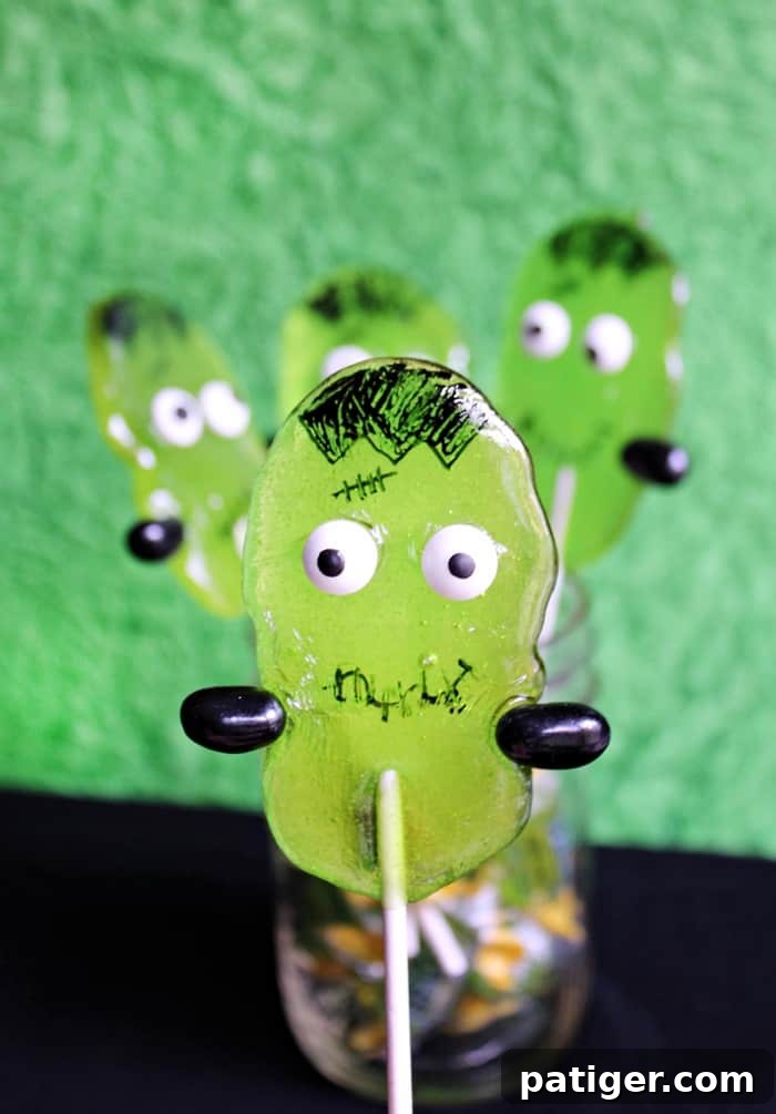 Making cute Frankenstein Suckers is simple with store-bought candies, creating perfect Halloween party favors.