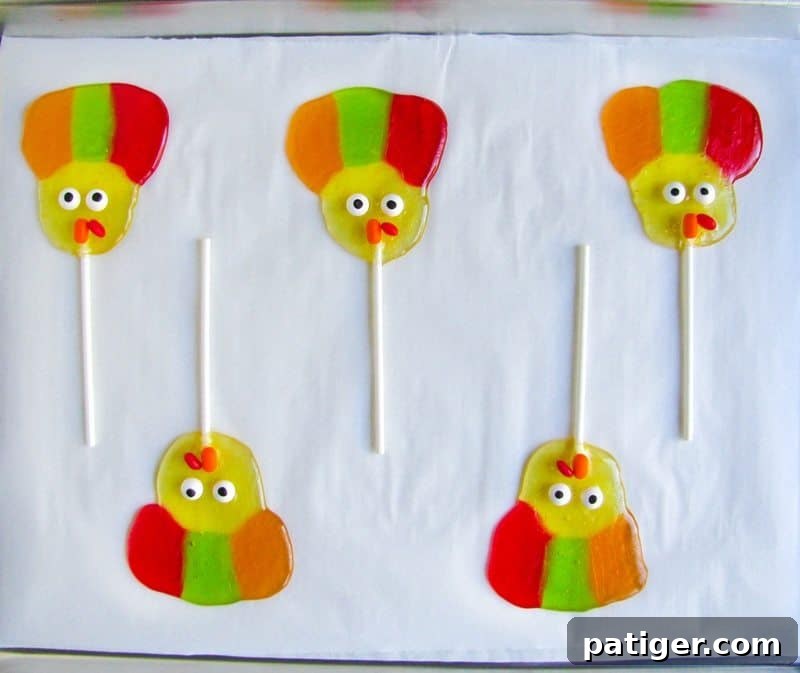 Turkey lollipops completed on lined cookie sheet.