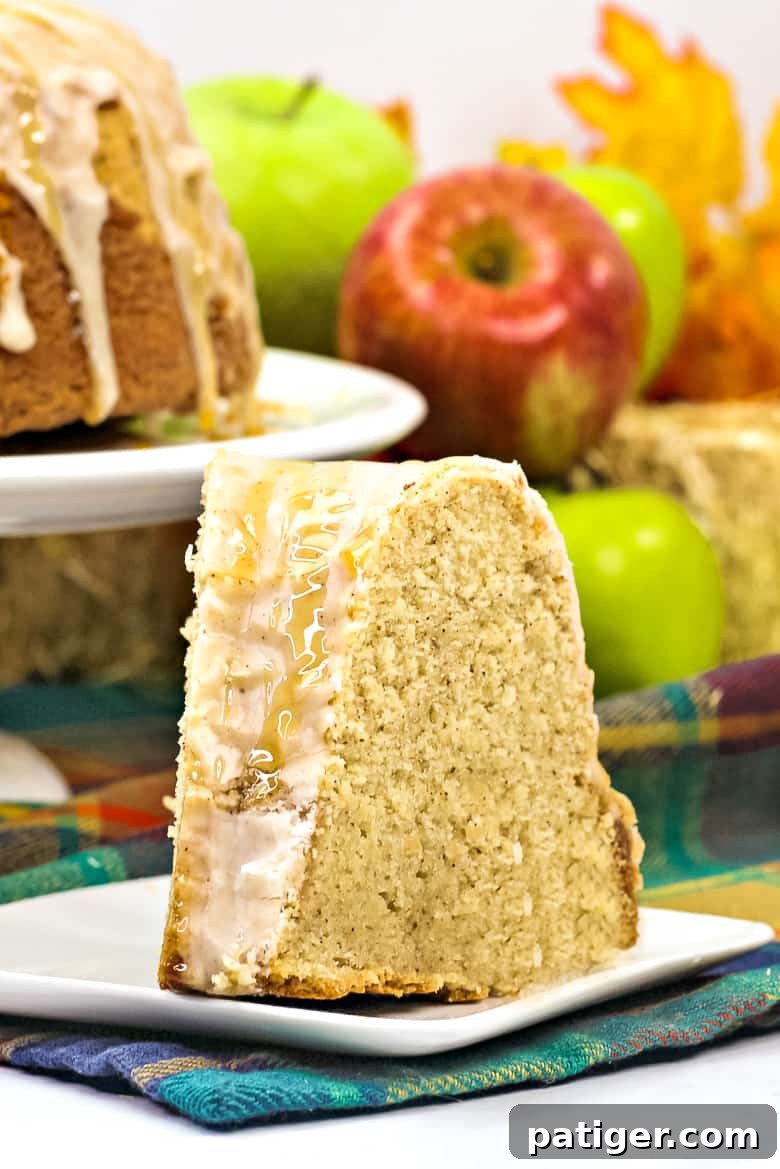Apple Cider Bundt Cake topped with glazes and drizzle of caramel sauce.