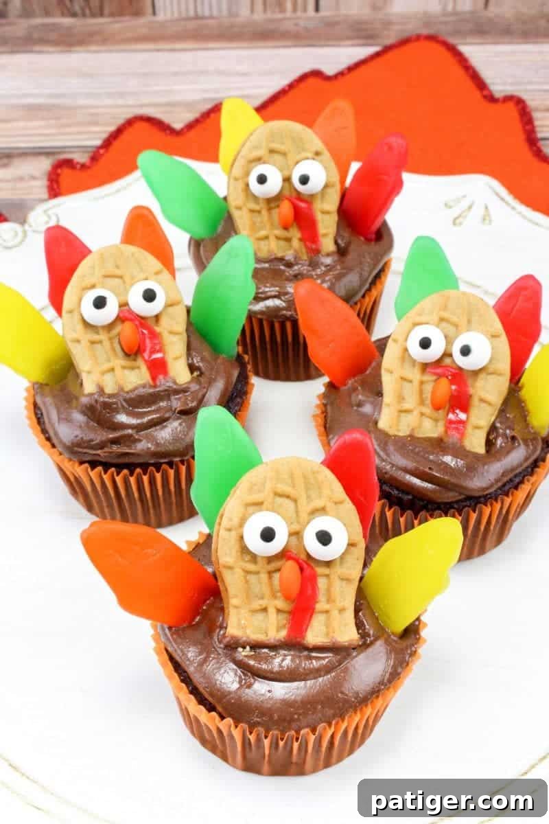 Made with Nutter Butters, Fruit Roll-Ups, Swedish Fish, and mini M&Ms, turkey cupcakes are colorful, tasty, and so much fun for the kids to help create.