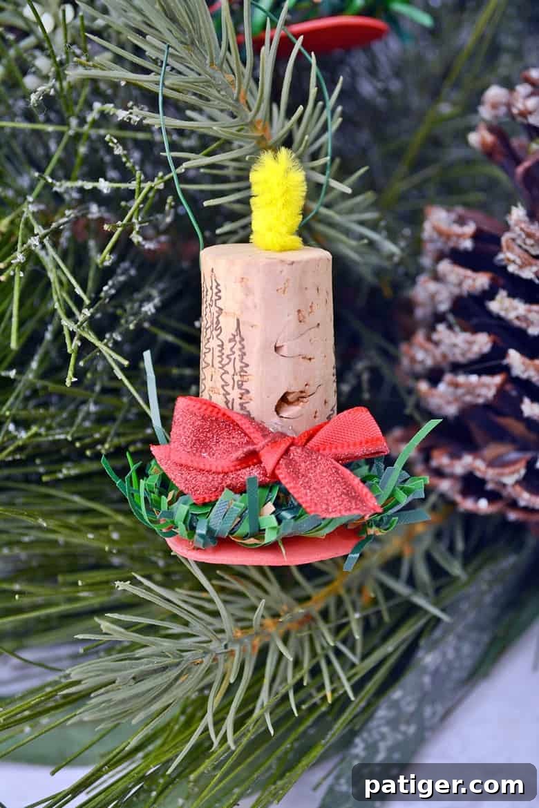 Elegant cork candle ornament, made from repurposed wine corks and minimal festive embellishments.