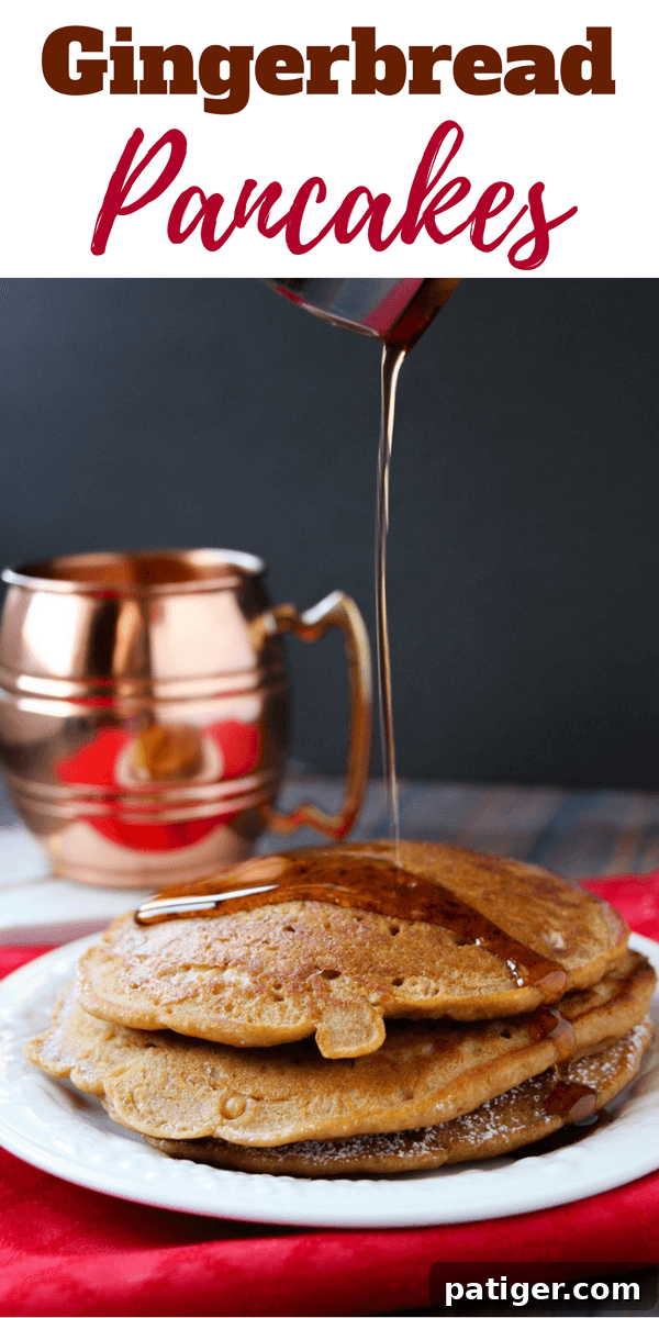 Fluffy gingerbread pancakes stacked high, drizzled with maple syrup, ready for a perfect Christmas morning breakfast.