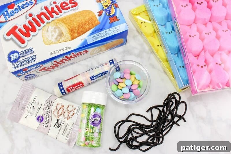Peeps Twinkie car ingredients: Easter Peep candies, Twinkies, pastel M&Ms, white candy melts, easter sprinkles, black licorice ropes, and Necco wafer candies.