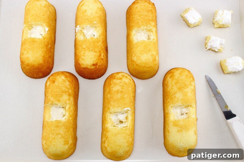 6 Twinkies with squares cut out of the top to place Peeps.