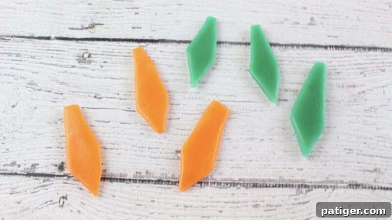 Father's Day Dipped Oreo Delights 9 Vibrantly colored orange and green tie shapes, meticulously cut from Airhead candy, ready to adorn the Father's Day chocolate-covered Oreos.