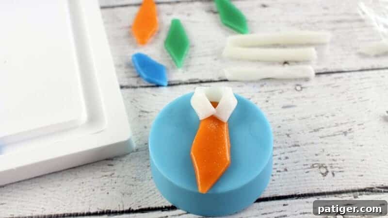 Father's Day Dipped Oreo Delights 10 Delicious chocolate-covered Oreos adorned with meticulously placed candy ties and white folded collars, creating charming Father's Day treats.