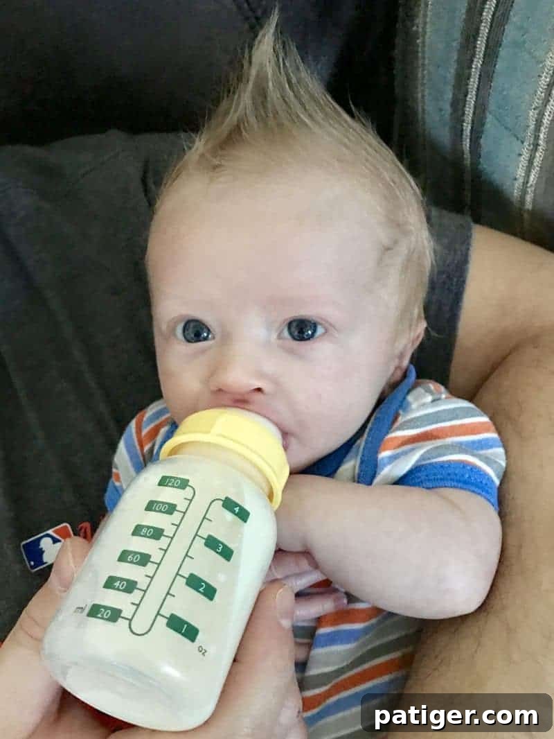 Your 11-Item Bottle Feeding Survival Kit 3 Baby Drinking 4 ounce bottle of formula.