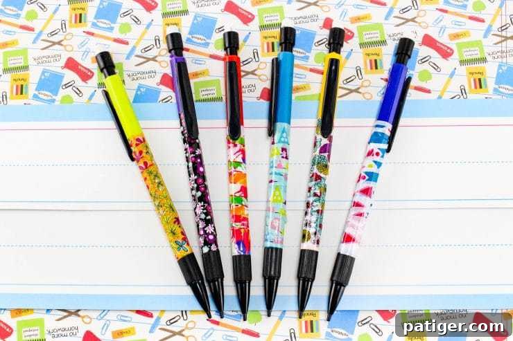 Personalize Your Pencils with Washi Tape for School 2 Close-up of vibrant mechanical pencils wrapped in patterned washi tape, showcasing various designs and colors. Perfect for a fun back-to-school craft.