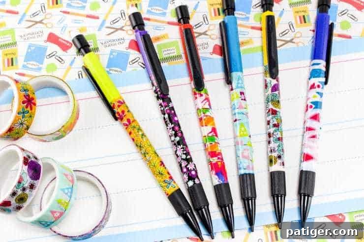Personalize Your Pencils with Washi Tape for School 4 An array of pencils beautifully covered in various patterns of washi tape, displayed alongside several rolls of washi tape, illustrating the craft in full splendor.