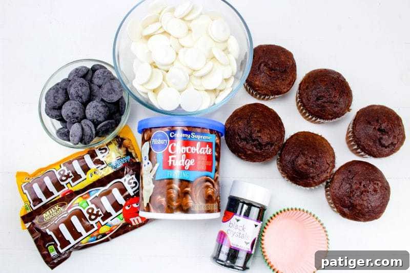 White candy melts, black candy melts, chocolate cupcakes, chocolate frosting, black sanding sugar, cupcakes liners, and regular and peanut M&Ms.