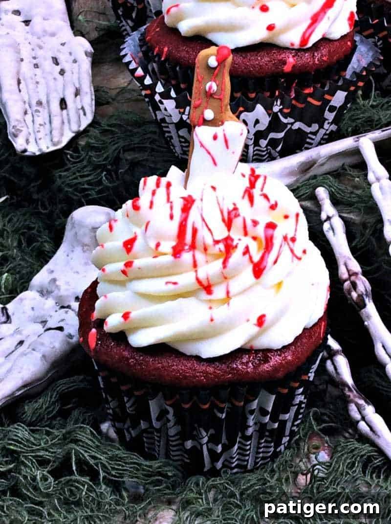 Crimson Confections 3 Blood splatter cupcakes with edible blood splatted on top.
