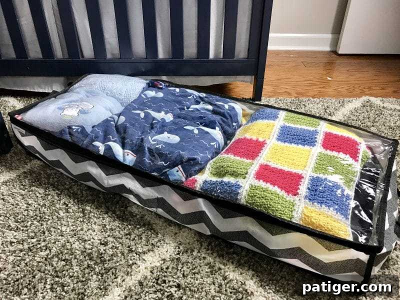 Baby blankets in fabric under-bed storage container. 
