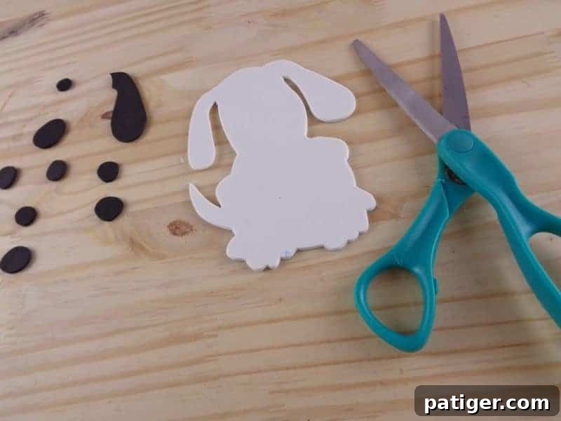Fun Letter D Dog Craft Printable 6 Step 4: Cut out the dog shape from the template and trace onto white craft foam for the Letter D craft.