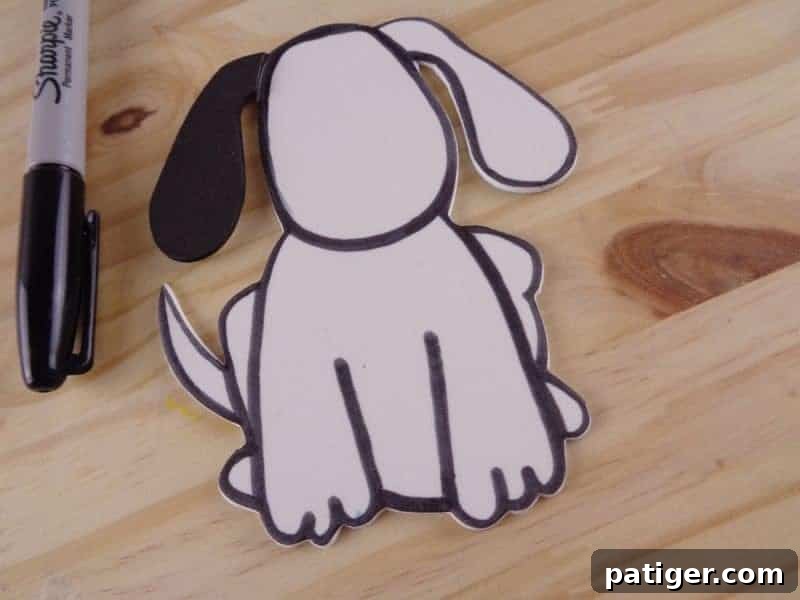 Fun Letter D Dog Craft Printable 8 Step 7: Outline the dog with a black marker to add definition and help features stand out.
