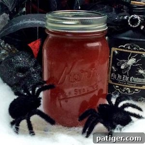Black widow venom halloween moonshine in mason jar.