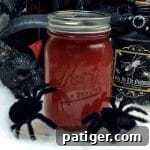 Black widow venom halloween moonshine in mason jar.