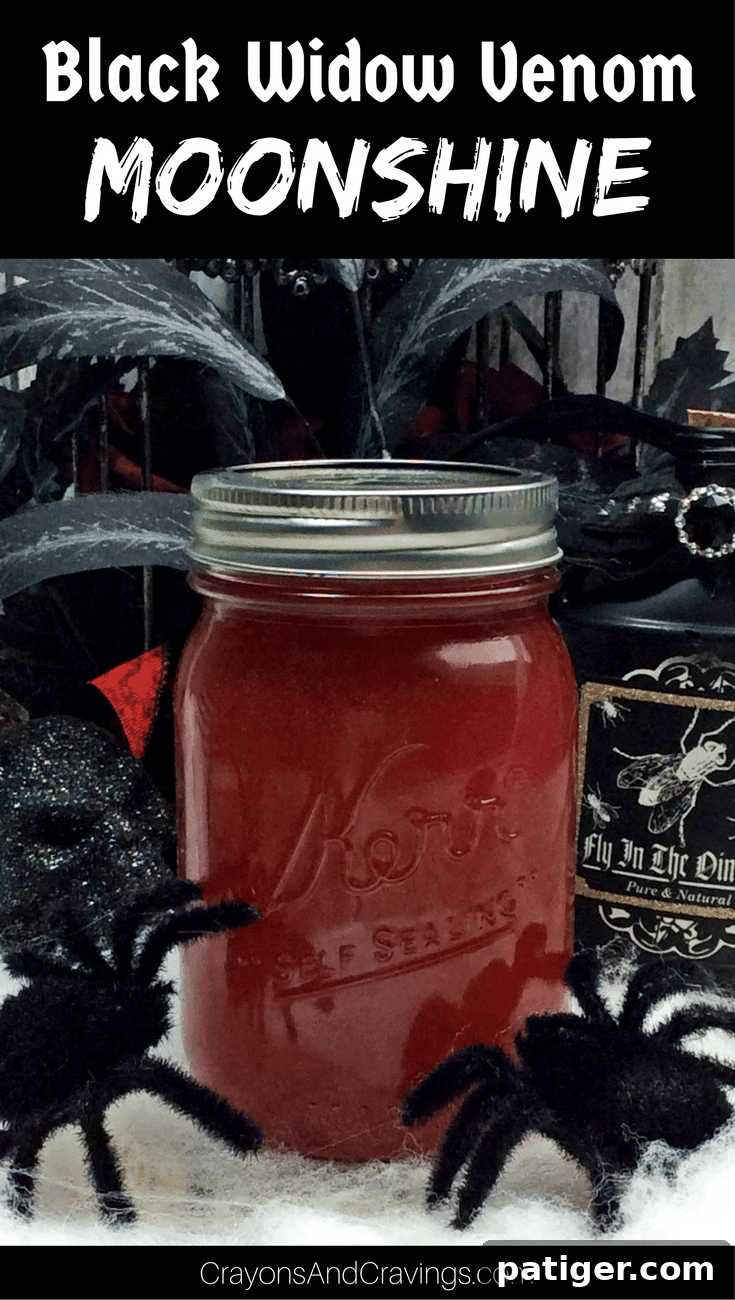 Cinnamon strawberry moonshine in glass mason jar.