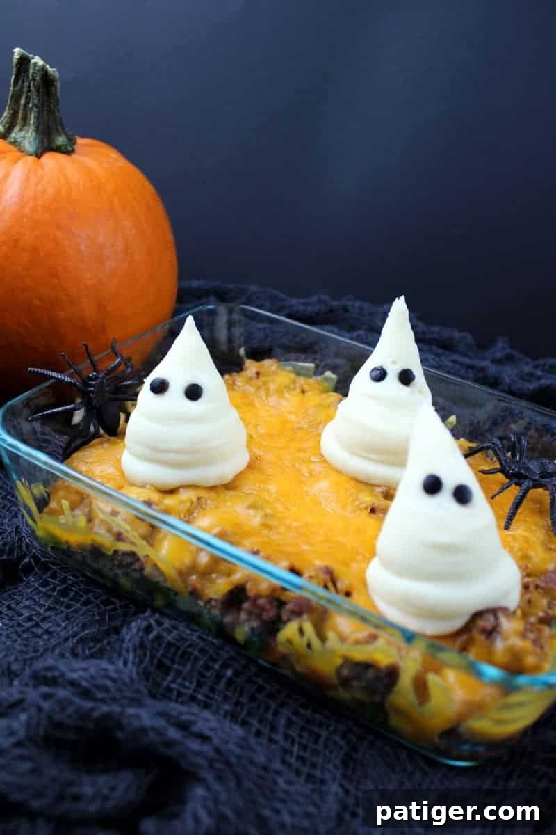 Graveyard Shepherd's Pie 5 Haunted Shepherd's Pie in glass baking dish with ghosts made from mashed potatoes on top.