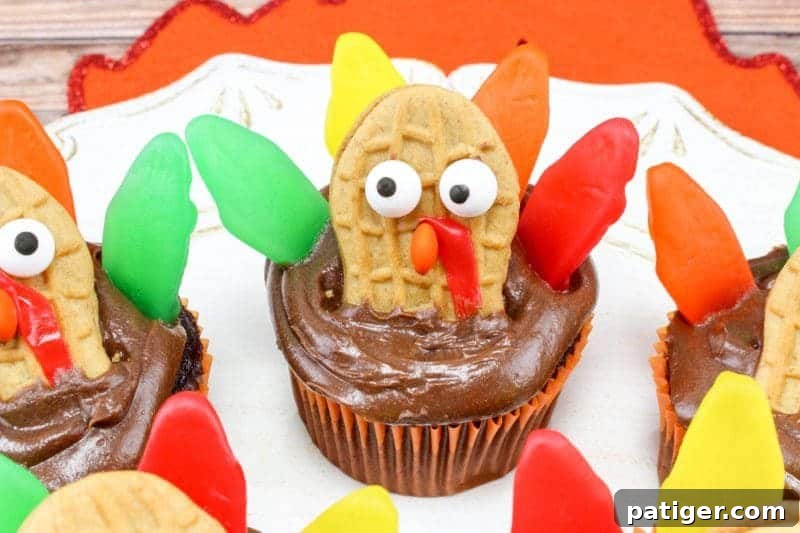 Turquoise Sweet Cupcakes 3 Nutter Butter, Fruit Roll-Up, Swedish Fish, and mini M&M decorated turkey cupcakes are colorful, tasty, and fun for kids to create.