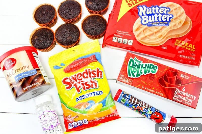 Turquoise Sweet Cupcakes 4 Ingredients for Thanksgiving Turkey Cupcakes: Nutter Butters, Fruit Roll-Ups, Swedish Fish, mini M&M's, chocolate cupcakes, chocolate frosting, and edible eyes.