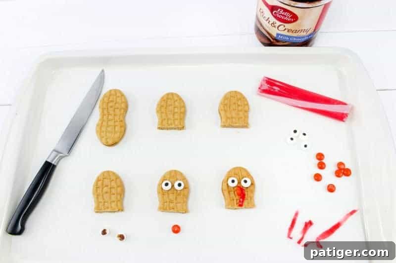 Turquoise Sweet Cupcakes 5 First step for turkey cupcakes: cut Nutter Butter cookies.