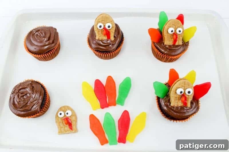 Turquoise Sweet Cupcakes 6 Second step for turkey cupcakes: frost cupcakes and attach turkey cookie faces.