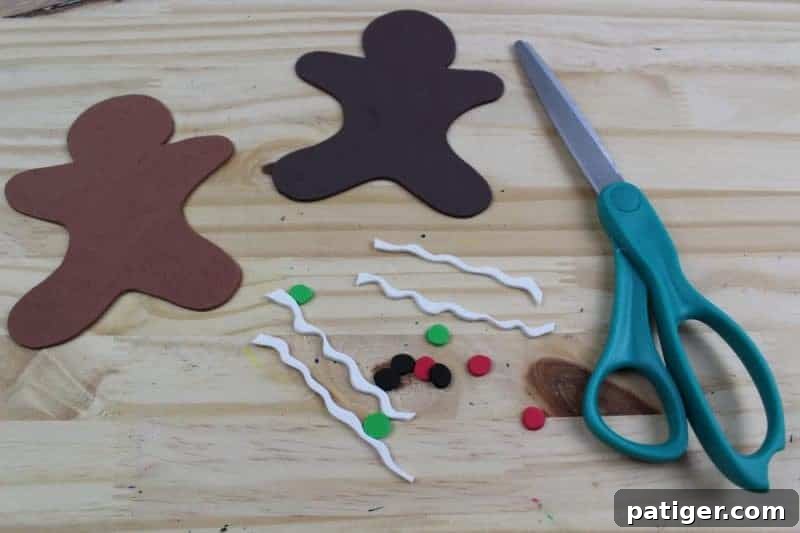 Third step: Cut gingerbread men shapes from the printable template, carefully trace them onto brown craft foam, and then precisely cut them out, ready for decoration.