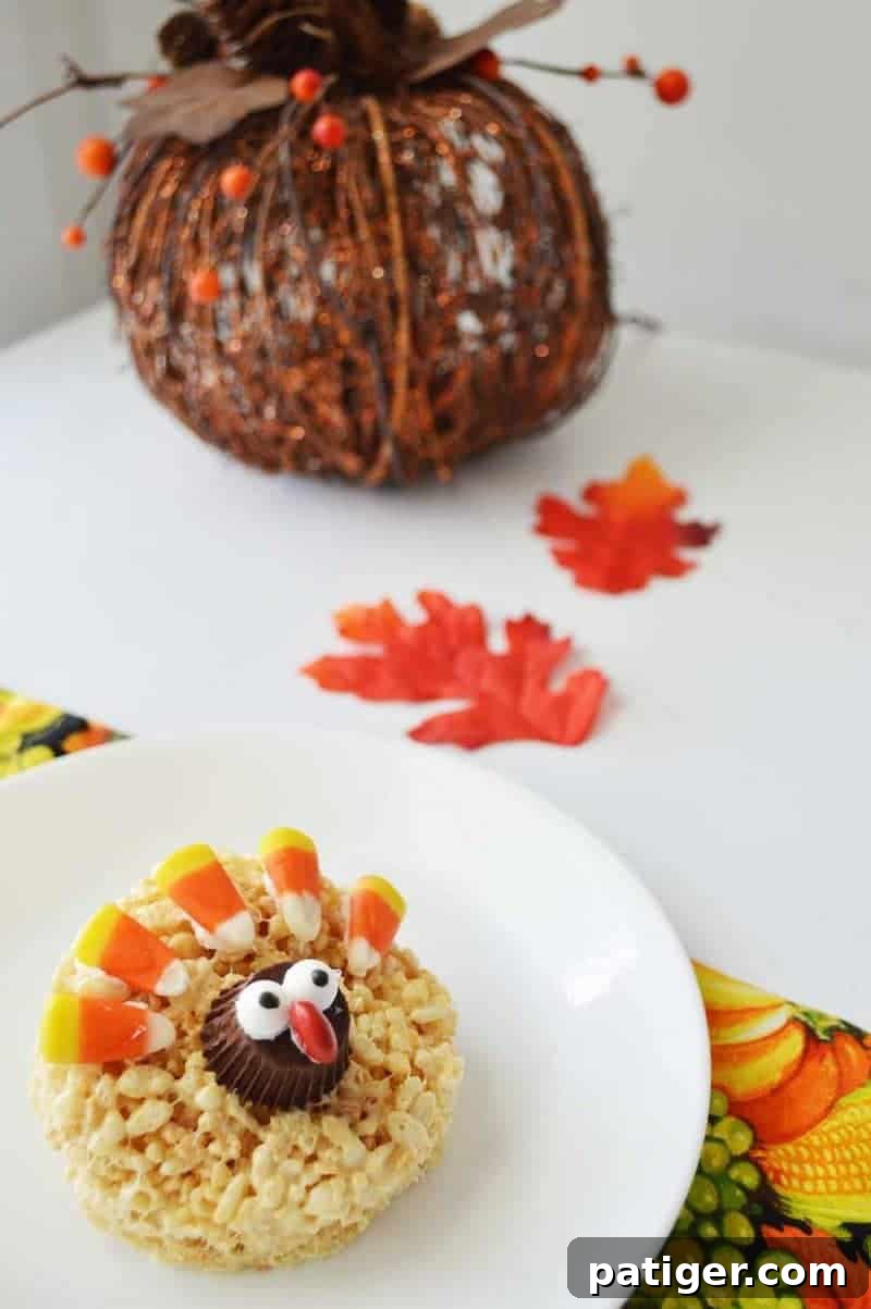 A close-up view of beautifully decorated Turkey Rice Krispie Treats, showcasing candy corn feathers and peanut butter cup heads
