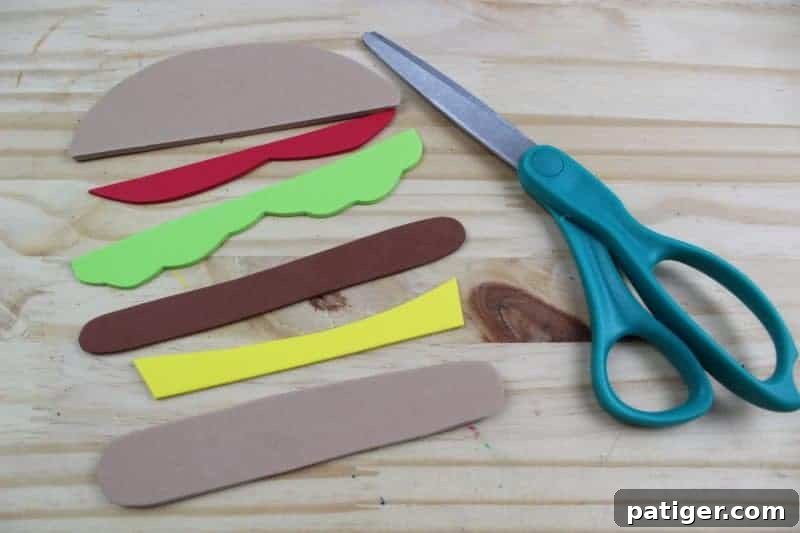 Carefully cut out all the individual hamburger components from the template and trace them onto colored craft foam, preparing all the delicious layers.