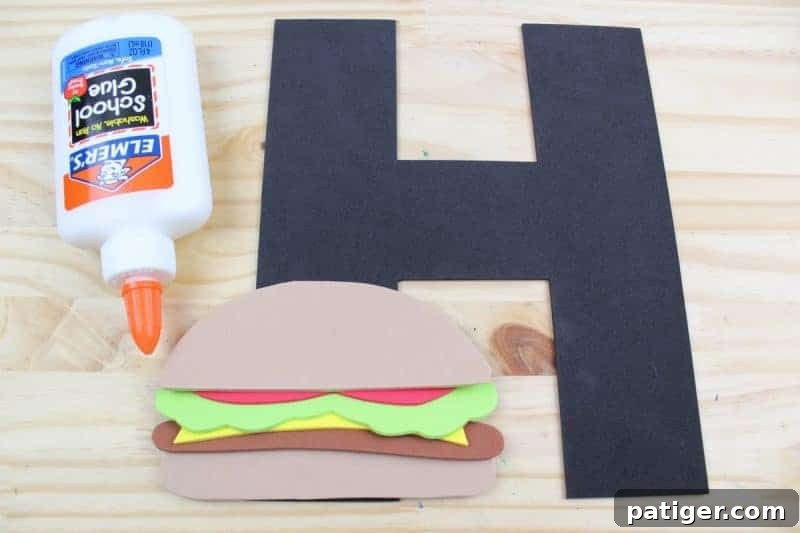 Begin assembling your Letter H hamburger by gluing the various delicious layers onto the foam letter H, creating a delightful 3D effect.