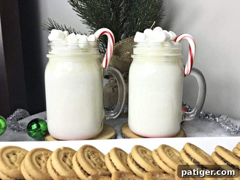 A cozy scene with a mug of white hot chocolate, perfect for winter evenings, garnished with a sprinkle of chocolate.