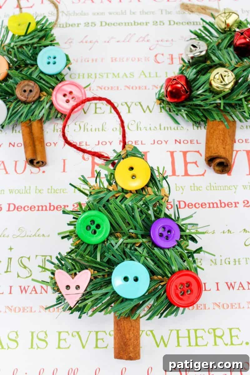 A closer look at the Cinnamon Stick DIY Christmas Tree Ornament craft, highlighting the texture of the cinnamon, green garland, and decorative elements.