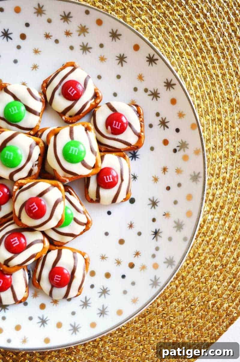 Effortless 3-Ingredient Holiday Pretzel Kisses 4 A festive platter filled with completed Christmas Pretzel Hugs, showcasing their vibrant colors and perfect melt, ideal for holiday parties and easy gifting.