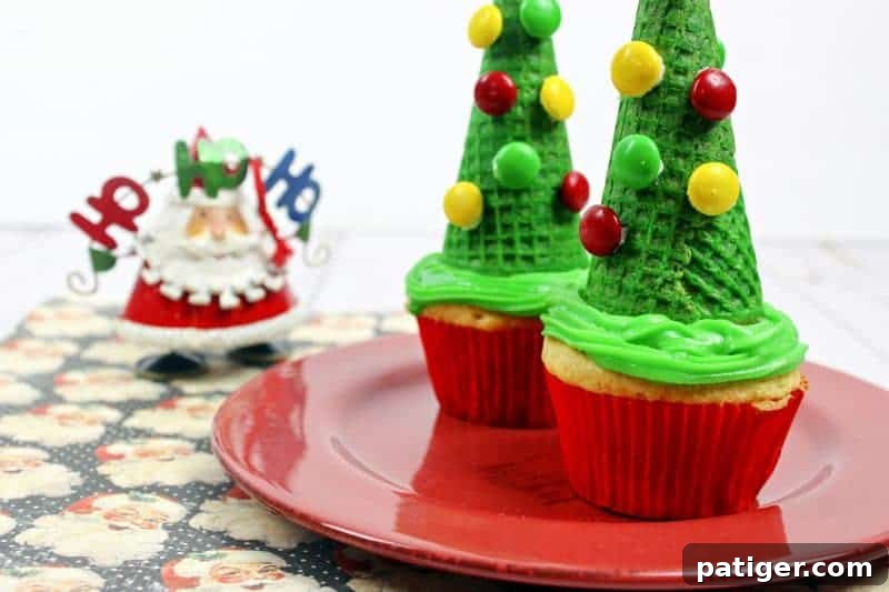 Kids decorating festive Christmas tree cupcakes with sugar cones and colorful candies, a perfect holiday activity.