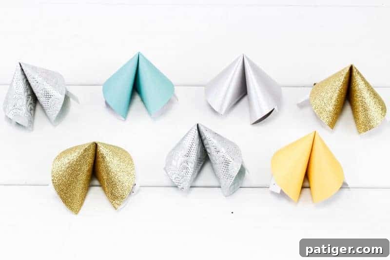 Sixth step in making paper fortune cookies: repeating the process for all paper circles and fortunes.