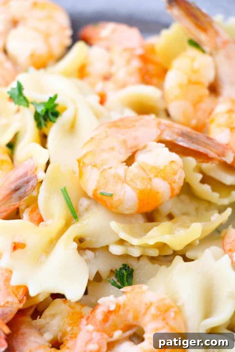 Garlic Butter Instant Pot Shrimp Scampi 3 Close-up of succulent shrimp scampi glistening in its sauce, ready to be tossed with pasta or rice for a quick and satisfying dinner.