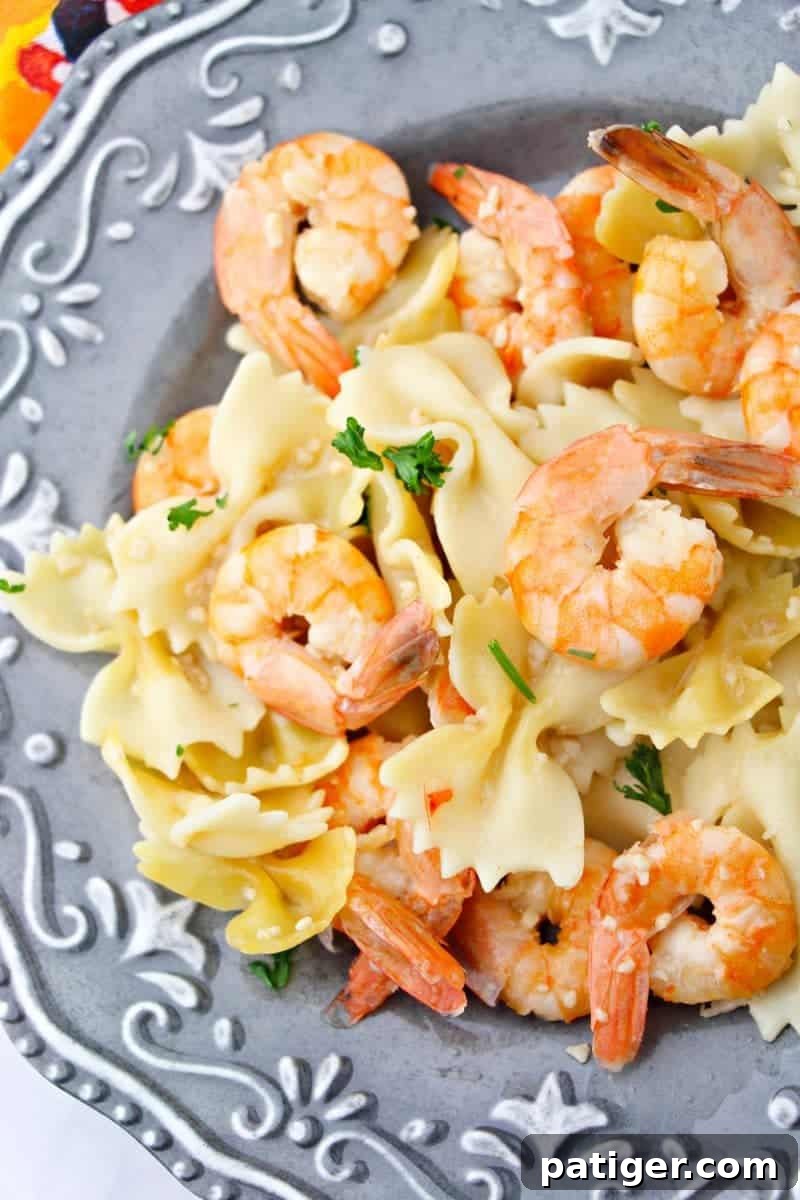 Garlic Butter Instant Pot Shrimp Scampi 9 A generous serving of Instant Pot Shrimp Scampi, vibrant and flavorful, garnished with fresh herbs and ready to enjoy.
